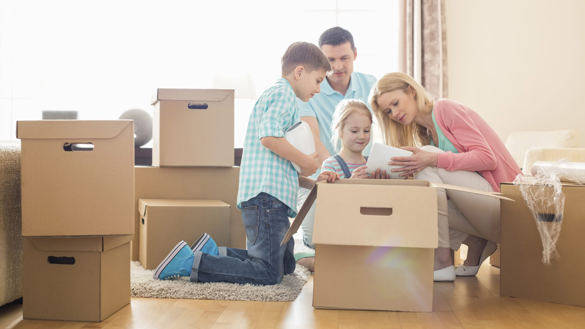 family packing their belongings