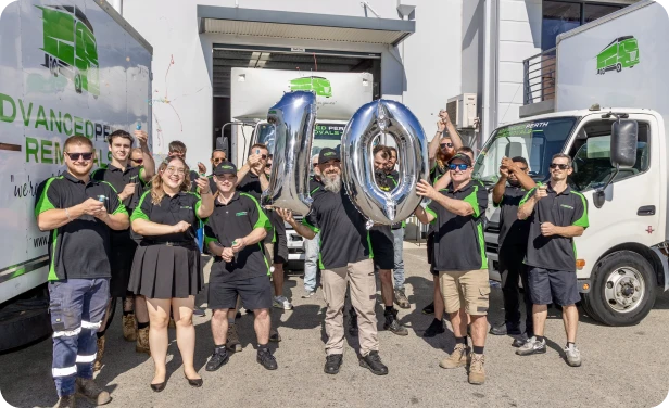 Advanced Perth Removals team celebrating 10 years with number balloons